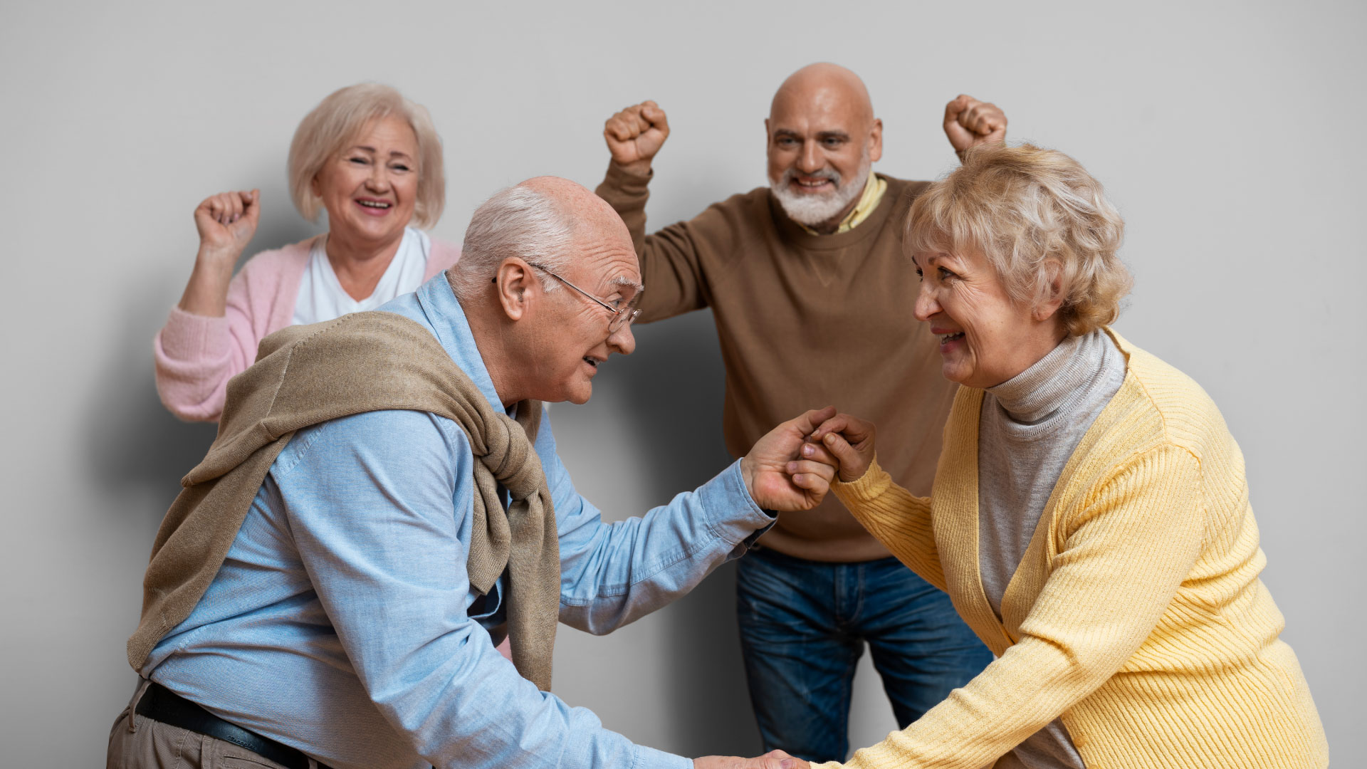 elder-friends-dancing-together-medium-shot