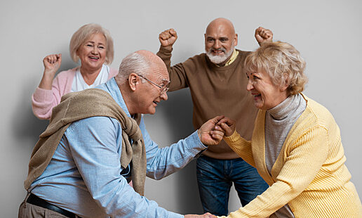 elder-friends-dancing-together-medium-shot